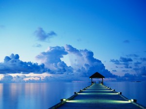 A dock at sunset on White Sands Island in the Maldives.